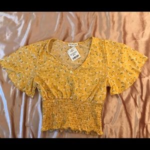 Yellow flower top size M brand new never used